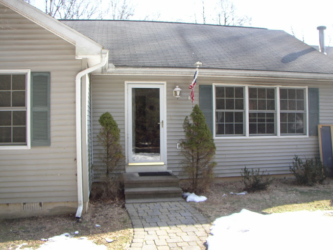 Front View of Residential House with New Shingle Roof