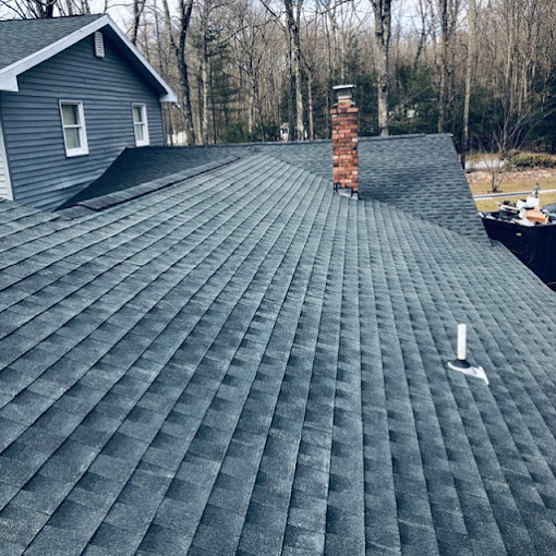 Roof View of Newly Installed Shingles with Chimney