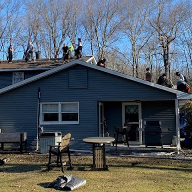 Symmetry's Roofing Contractors Working on Shingle Roof Installation