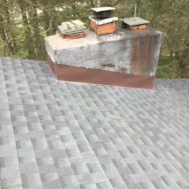 Newly Installed Asphalt Shingle Roof with Old Chimney