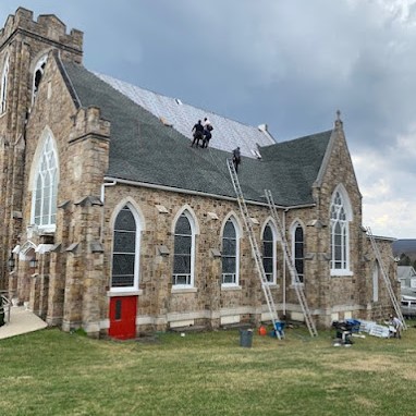 Roofing Contractors Beginning Roof Replacement of Stone Church